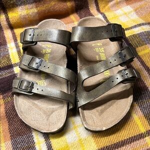 Birkenstock Florida Metallic Bronze leather flattened and has dinks from storage